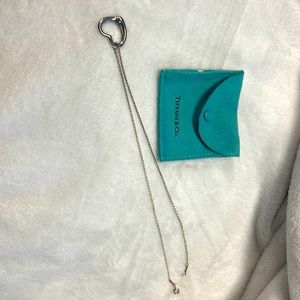 Tiffany & Co Elsa Peretti silver choker necklace with open heart pendant.